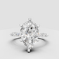 Unique pear-shaped engagement ring with sculptural band design