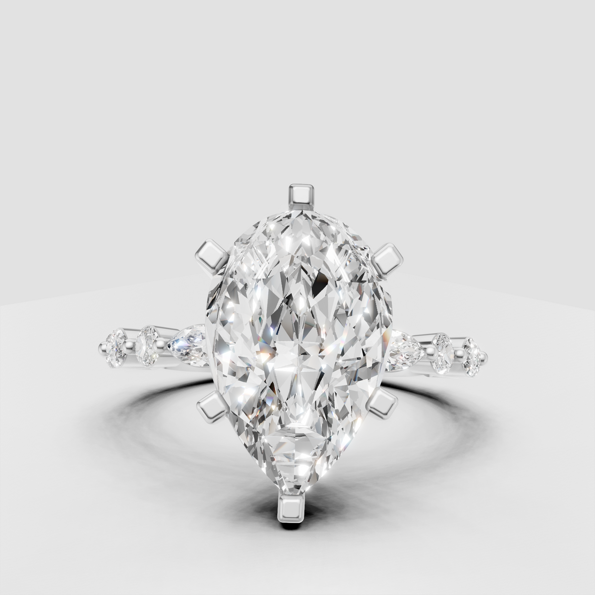 Unique pear-shaped engagement ring with sculptural band design