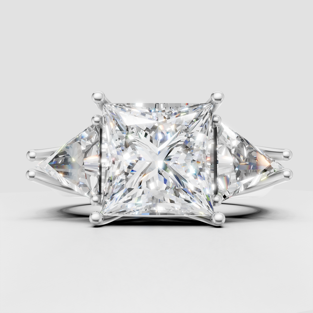 Princess diamond three stone engagement ring with yellow gold prongs