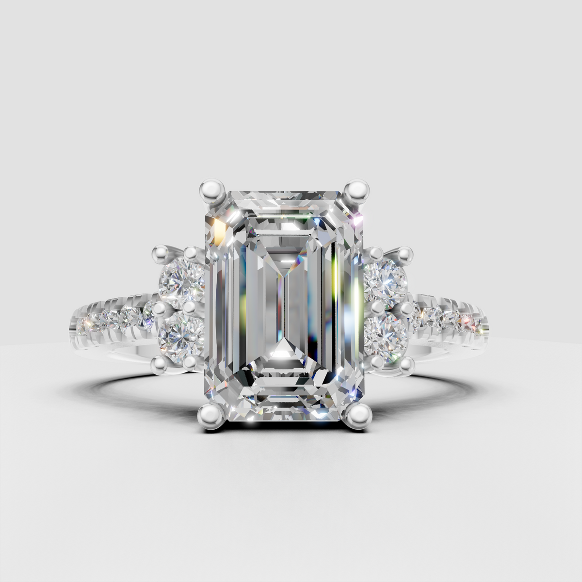 Glamorous emerald cut diamond engagement ring with pave band