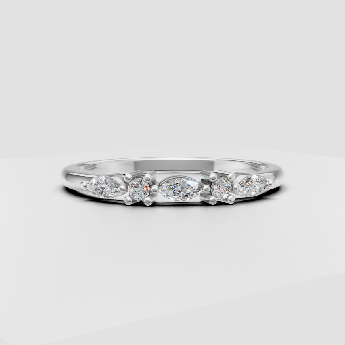 Side view of round and marquise diamond wedding band with open gallery