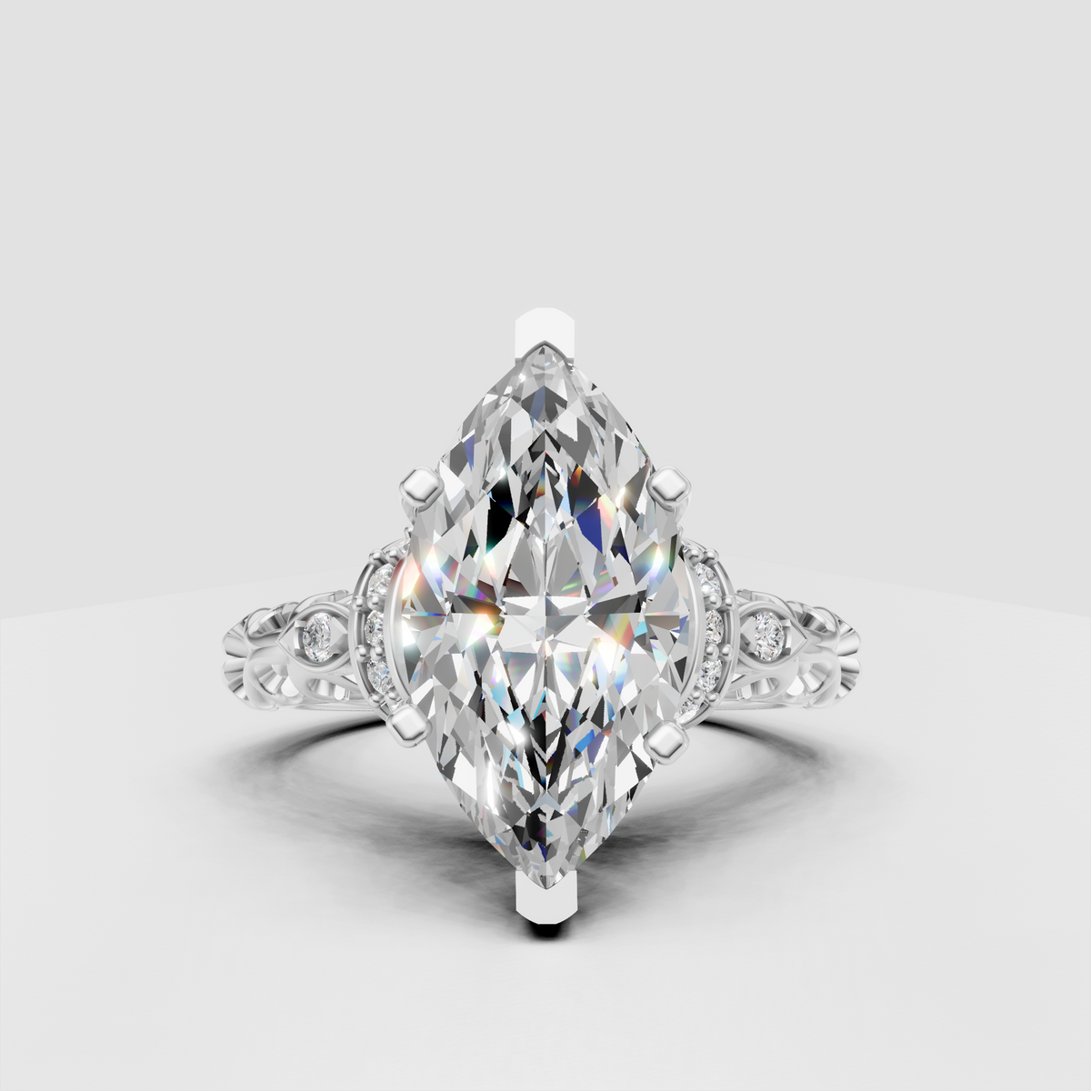 Yellow gold marquise engagement ring with elaborate scrollwork shoulders