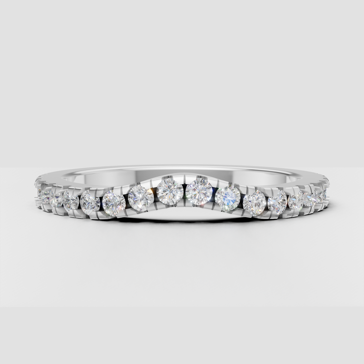 Round diamond wedding band with sparkling pavé upper half