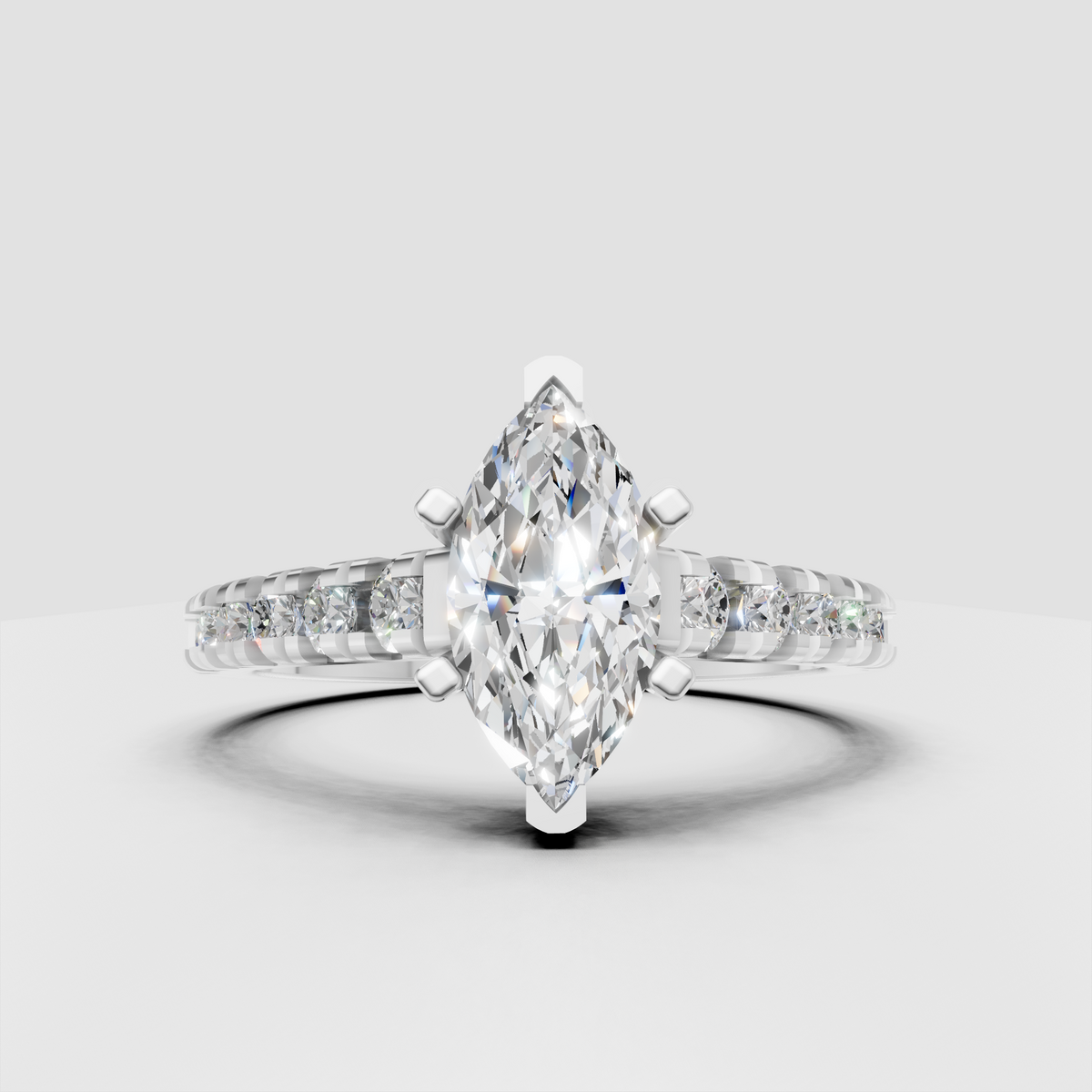 Marquise diamond ring with shared-prong side stones and polished gold band