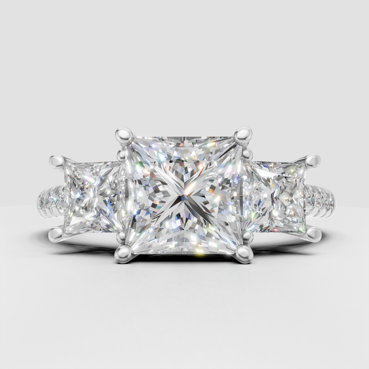 Luxury three-stone diamond engagement ring with princess cut center stone