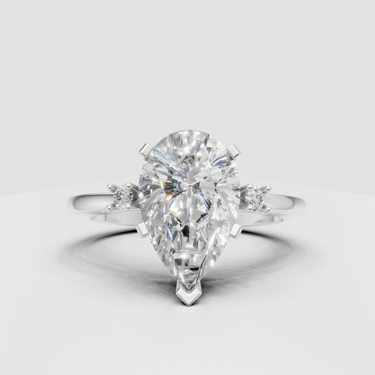 Elegant pear shaped diamond bridal ring in yellow gold