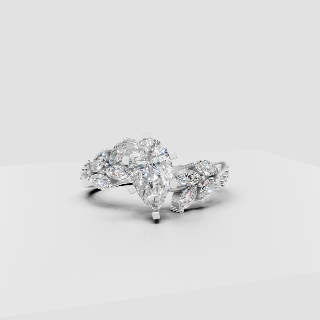 Yellow gold pear diamond ring with sculpted floral shoulders