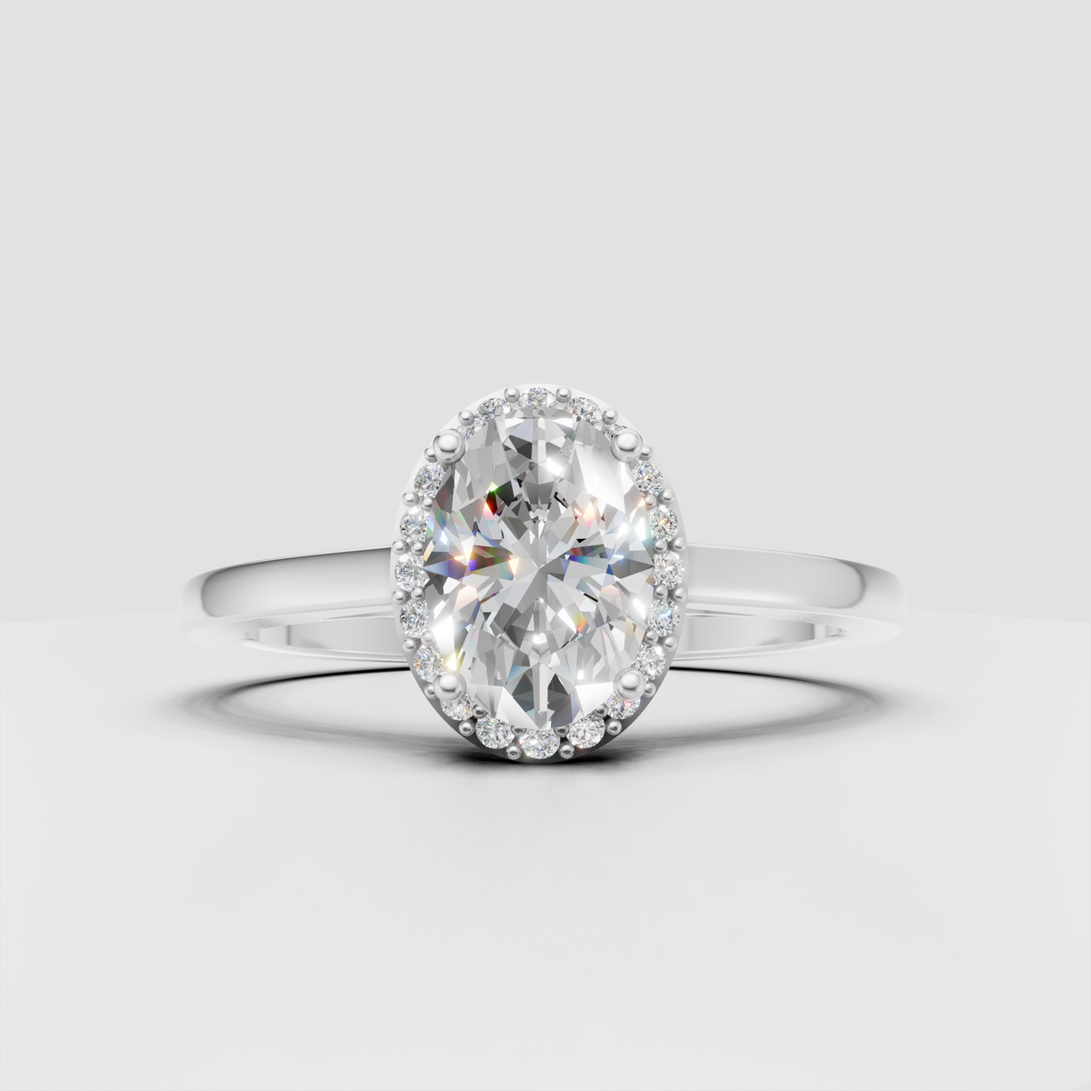 Oval diamond ring featuring a polished yellow gold band and halo