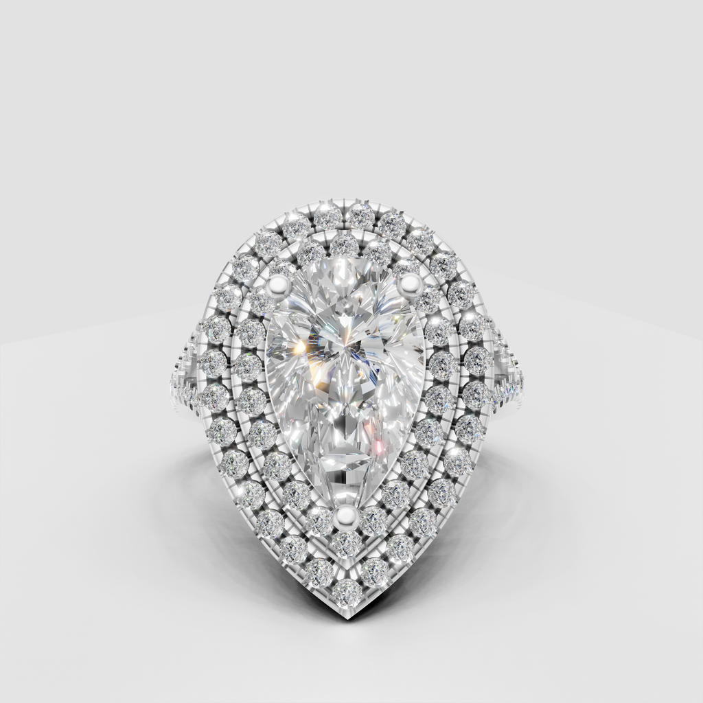 Pear cut diamond ring featuring four-prong center setting