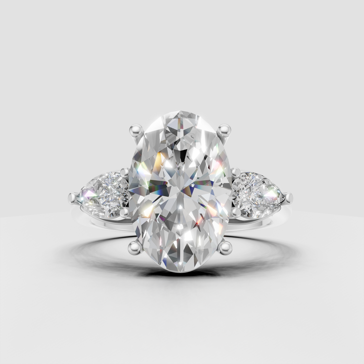 Luxury oval diamond engagement ring with marquise side stones and polished gold band
