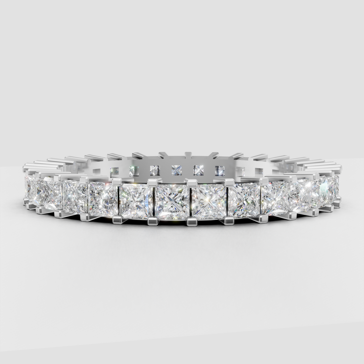 Polished yellow gold eternity ring with princess cut diamonds