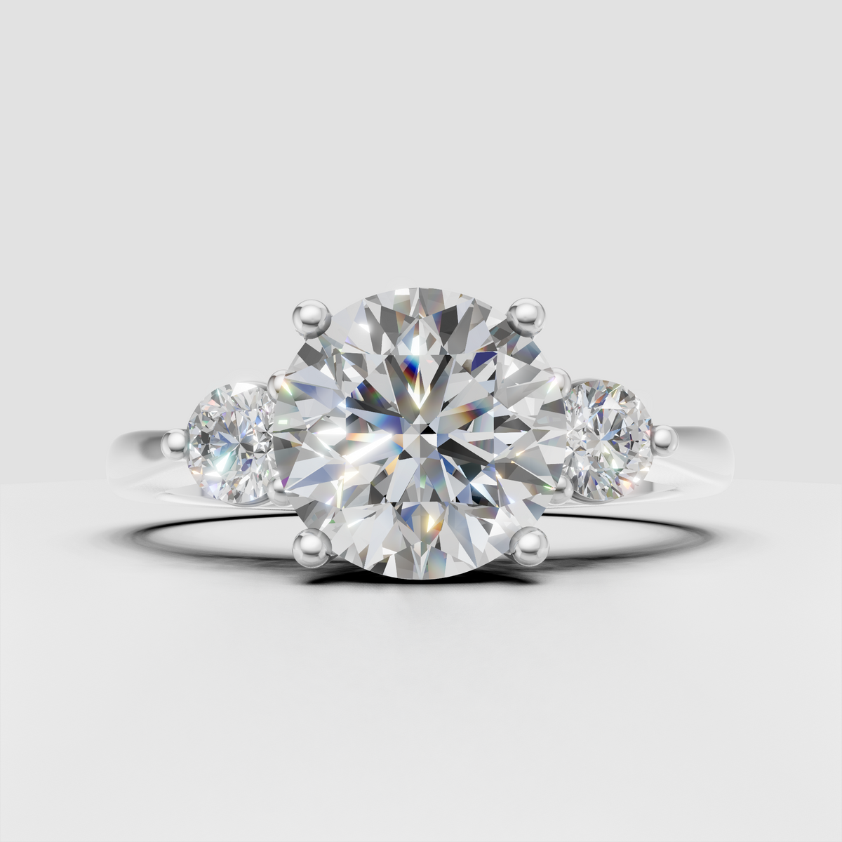 Classic three-stone Diamond engagement ring with gold band