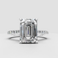 Emerald diamond engagement ring featuring a four prong setting