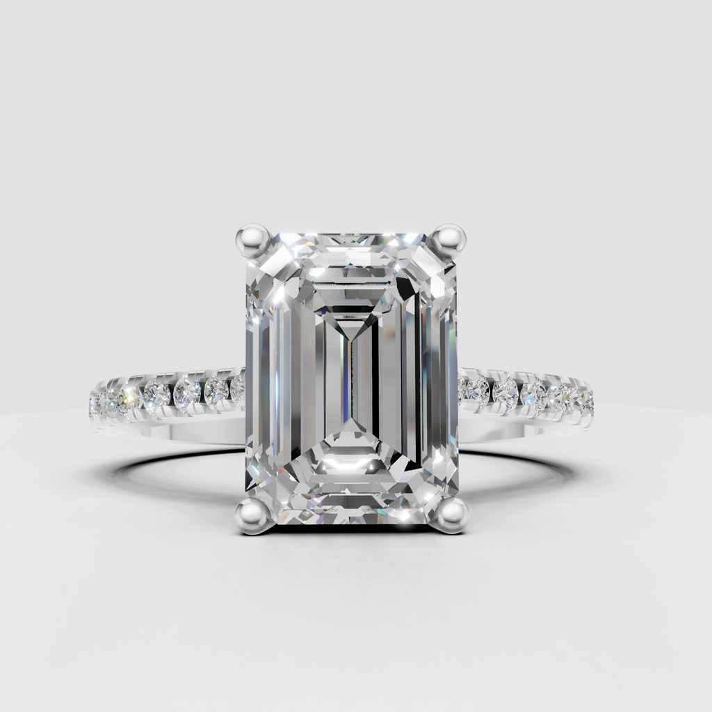 Emerald diamond engagement ring featuring a four prong setting