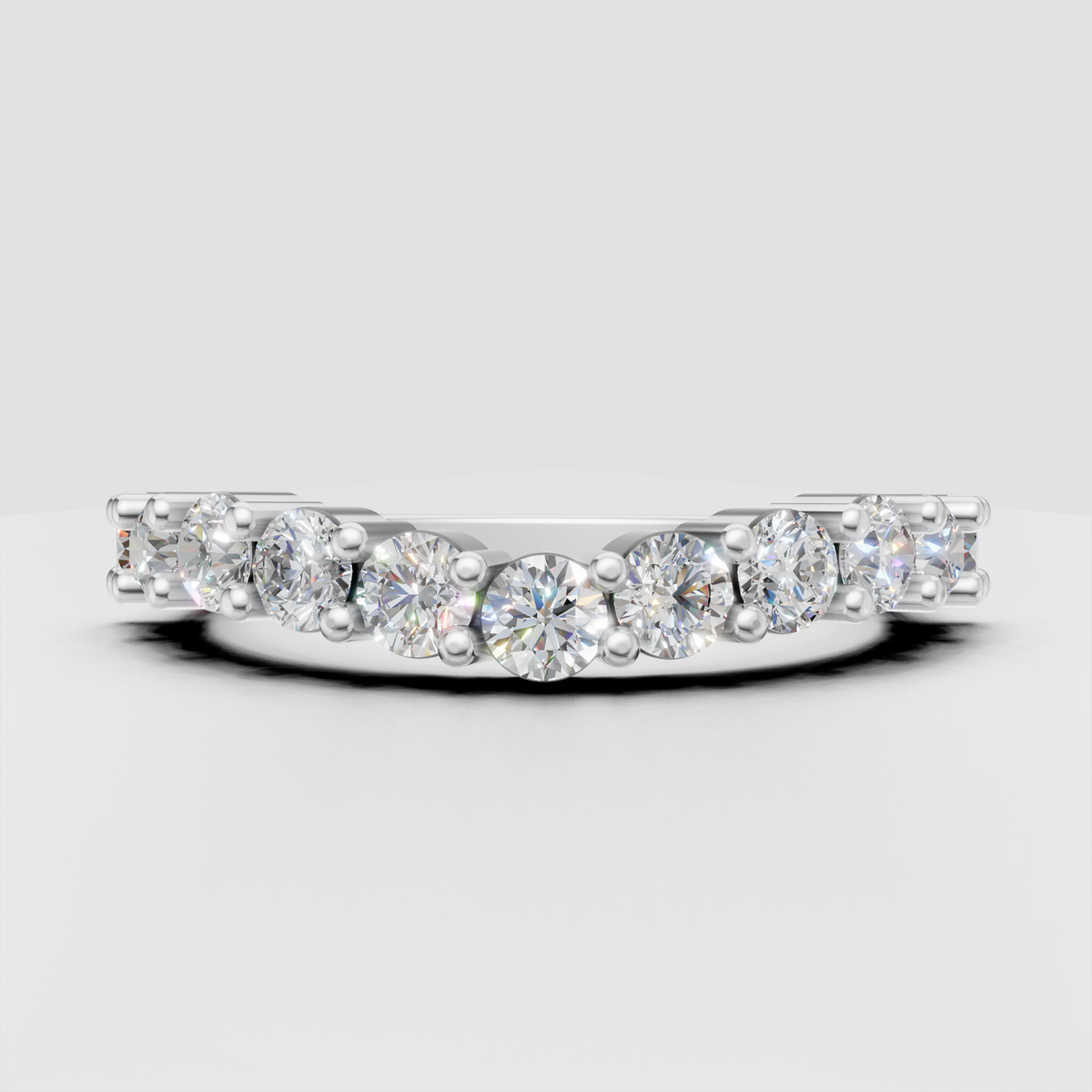 Shared prong round diamond band