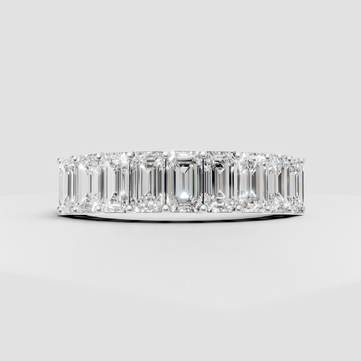 Emerald cut eternity wedding band with brilliant gemstones