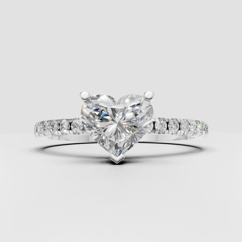 Heart cut diamond ring featuring a pavé diamond band