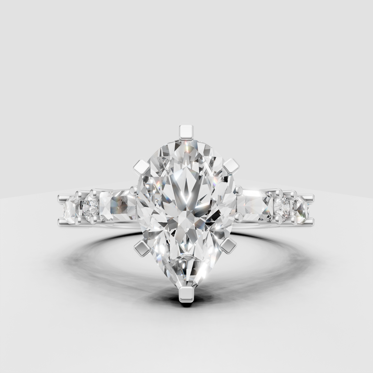 Pear diamond engagement ring with baguette and round pave accents