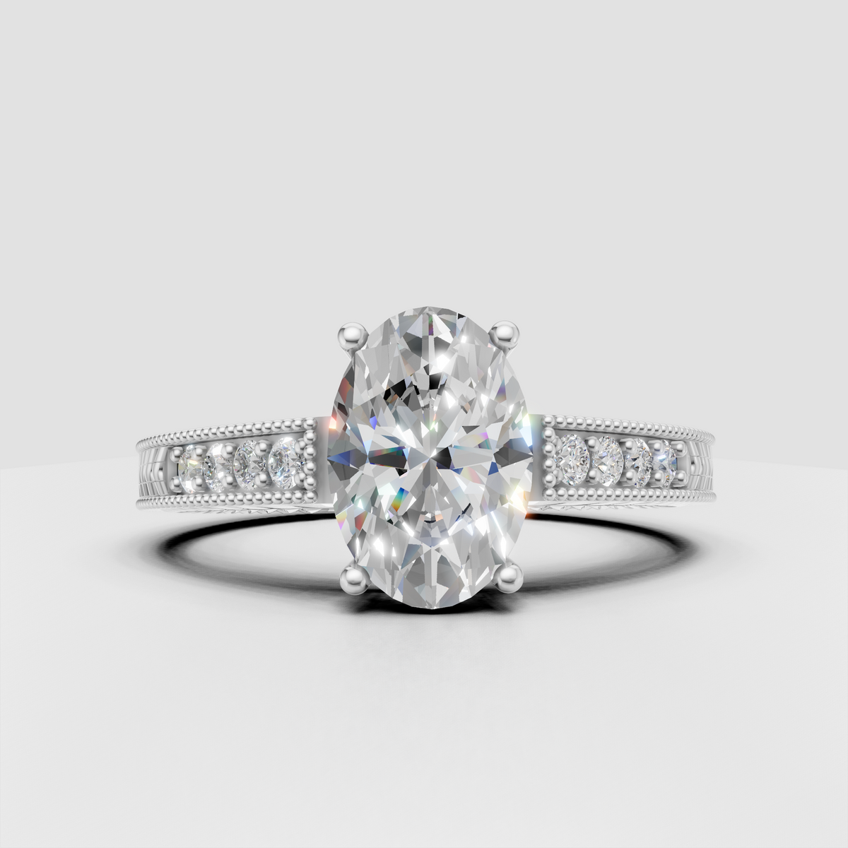 Oval diamond engagement ring with beaded milgrain borders and sculpted band