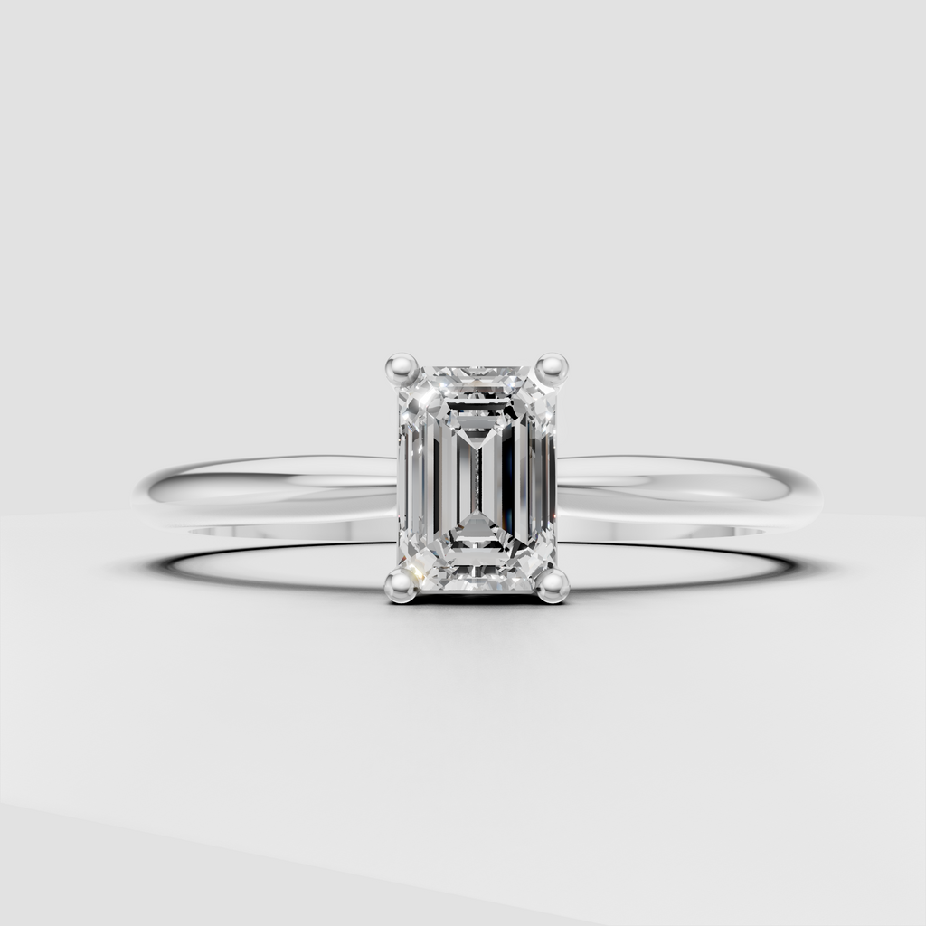Four-prong emerald cut diamond ring in yellow gold