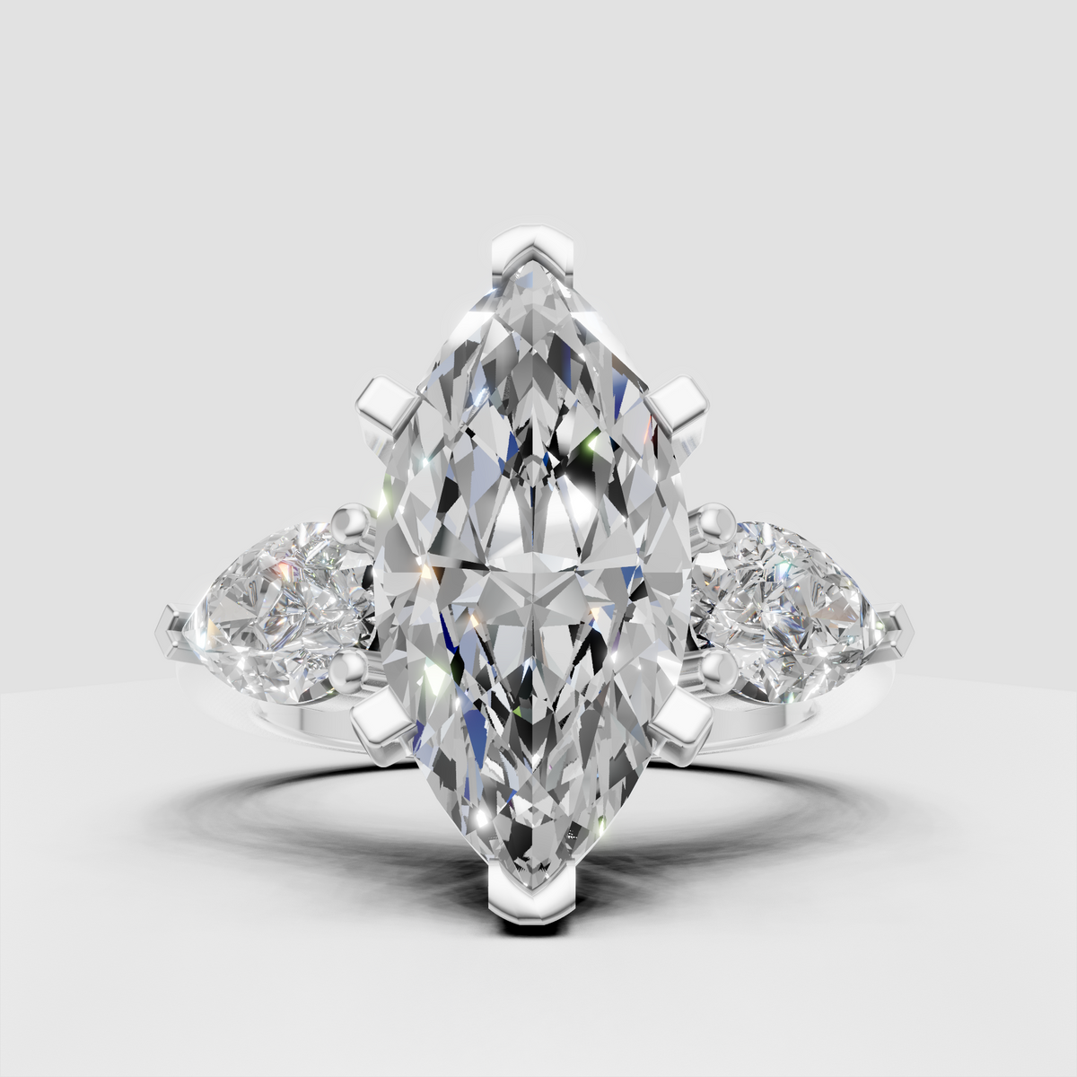 Marquise center diamond three stone ring in polished gold