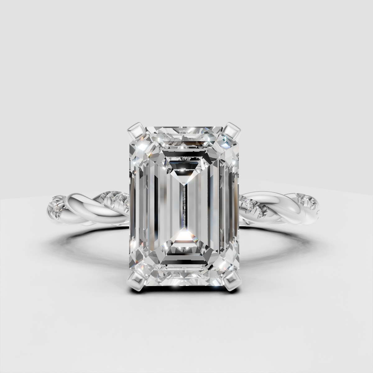 Luxury emerald cut diamond engagement ring with twisted pavé band