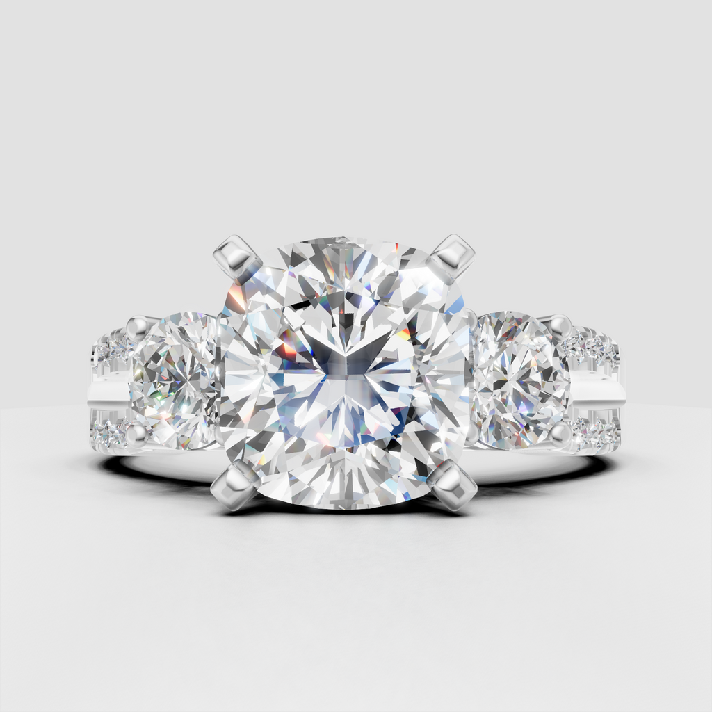Oval diamond three stone ring with split shank pavé shoulders