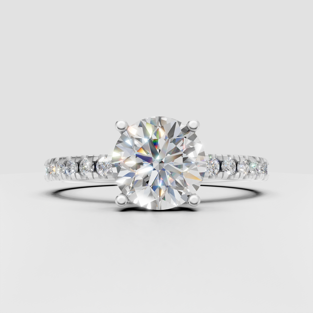 Round diamond ring featuring sparkling pavé side stones