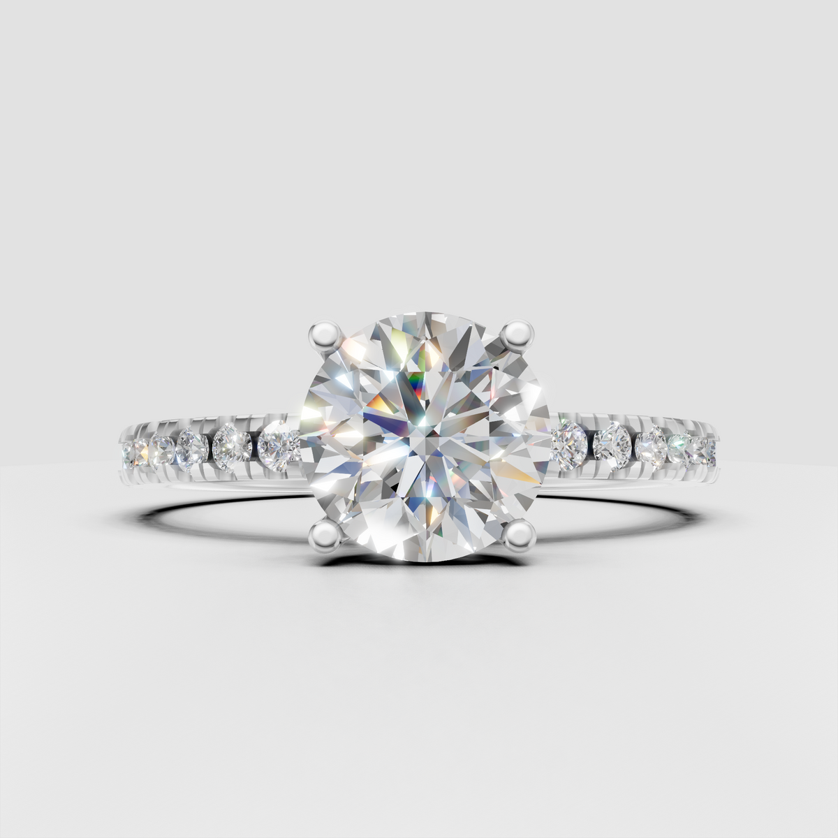 Round diamond ring featuring sparkling pavé side stones