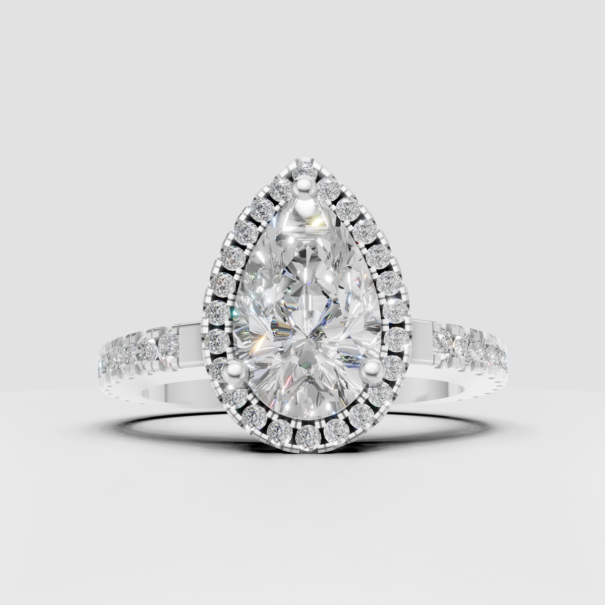 Luxury pear shaped halo diamond ring with pave shoulders