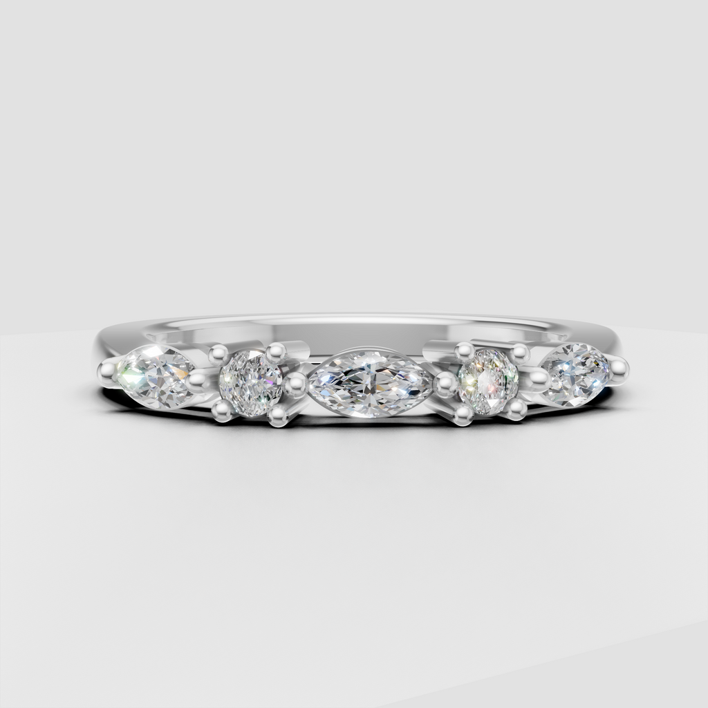Oval cut engagement ring featuring alternating diamond accents
