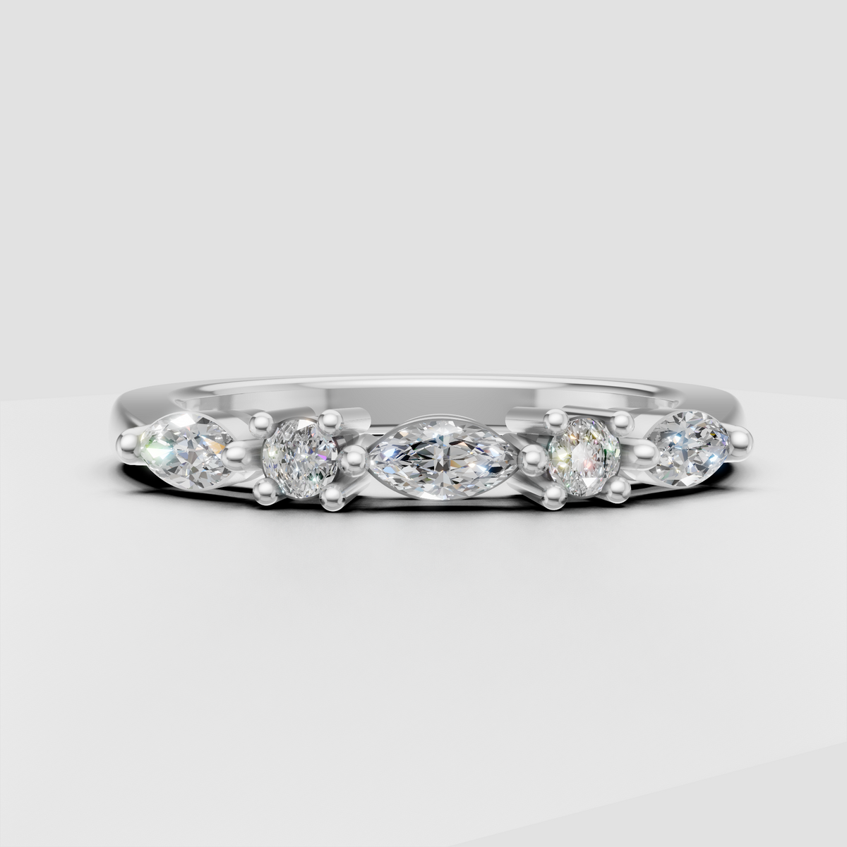 Oval cut engagement ring featuring alternating diamond accents