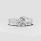 Heart-shaped diamond solitaire ring with flowing curved shoulders