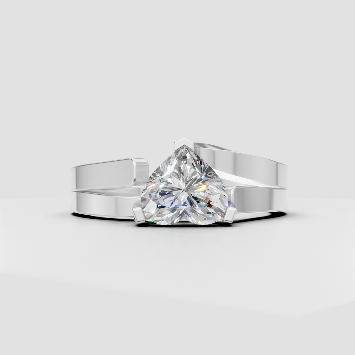 Heart-shaped diamond solitaire ring with flowing curved shoulders