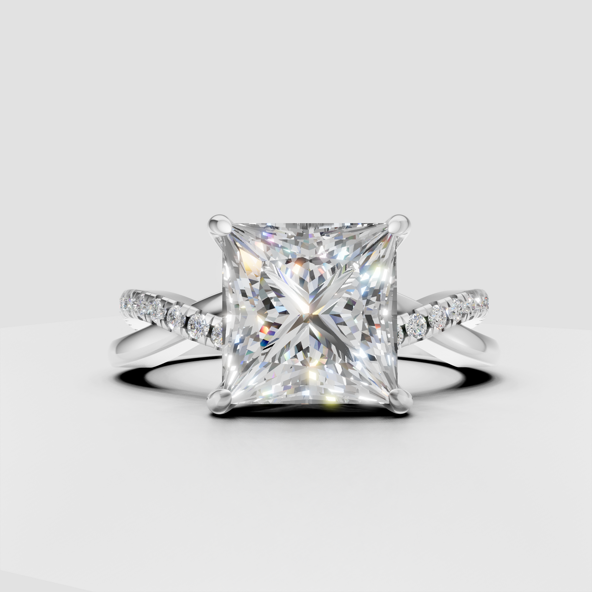 Four-prong princess diamond engagement ring with round side stones