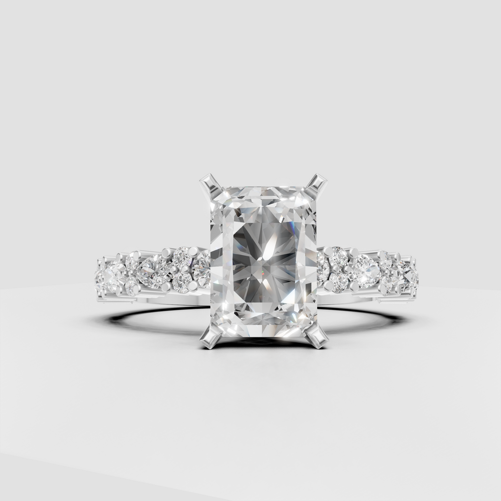 Radiant cut diamond solitaire with brilliant accent stones along the band