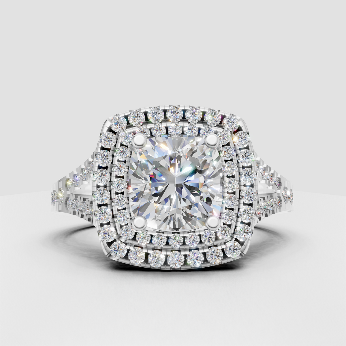 Double halo cushion diamond engagement ring in polished gold