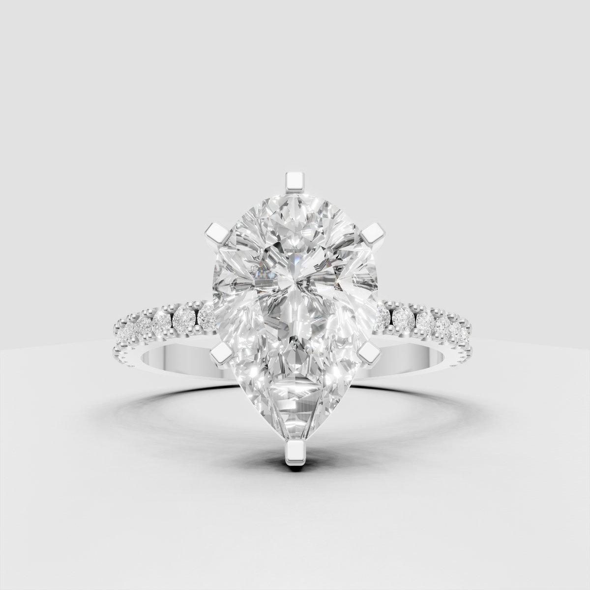 Elegant pear diamond engagement ring with slim pavé band
