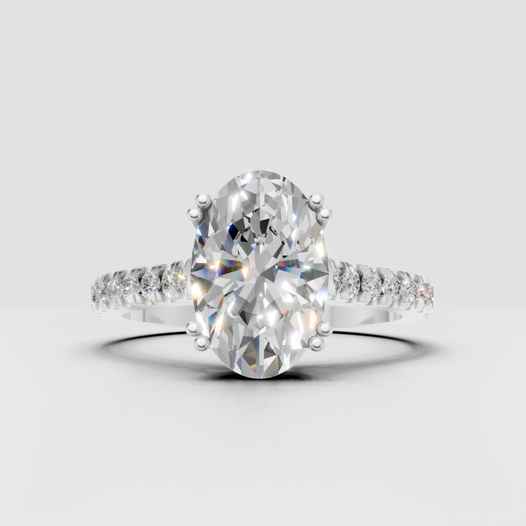 Oval cut diamond bridal ring with slim polished pave shoulders