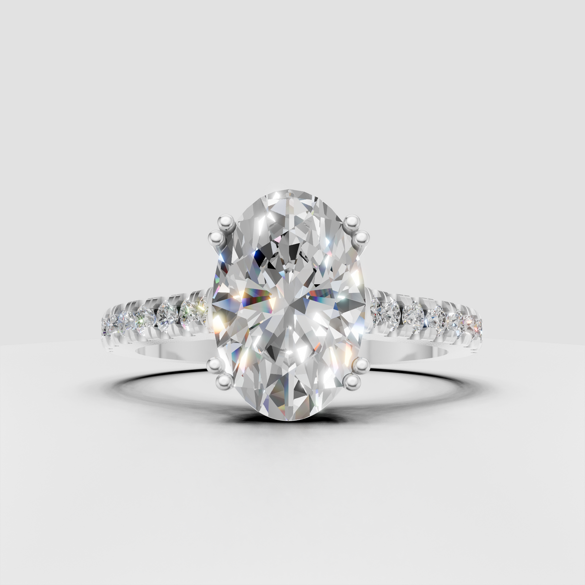 Oval cut diamond bridal ring with slim polished pave shoulders