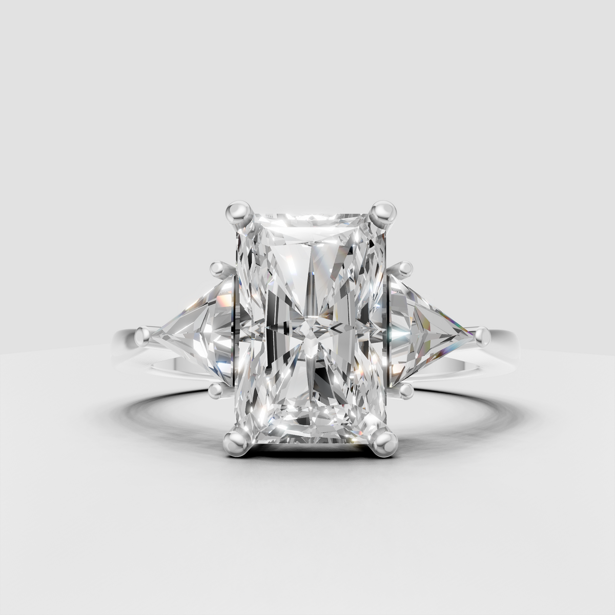Luxury radiant diamond engagement ring with sculptural prongs and yellow gold band