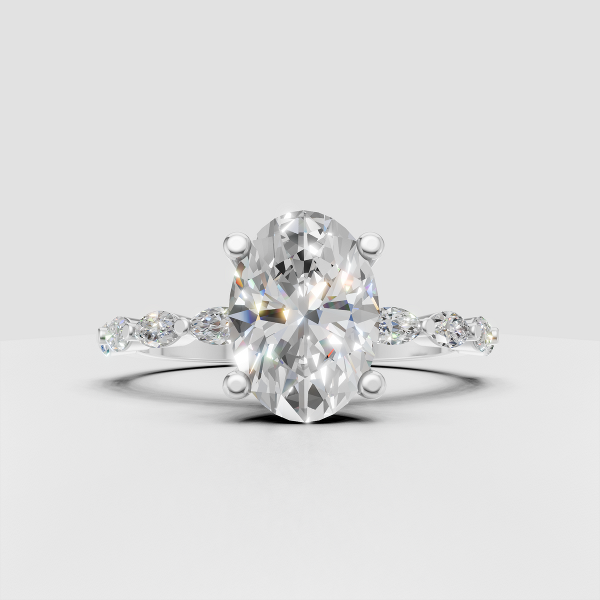 Oval engagement ring featuring alternating marquise diamond shoulder accents