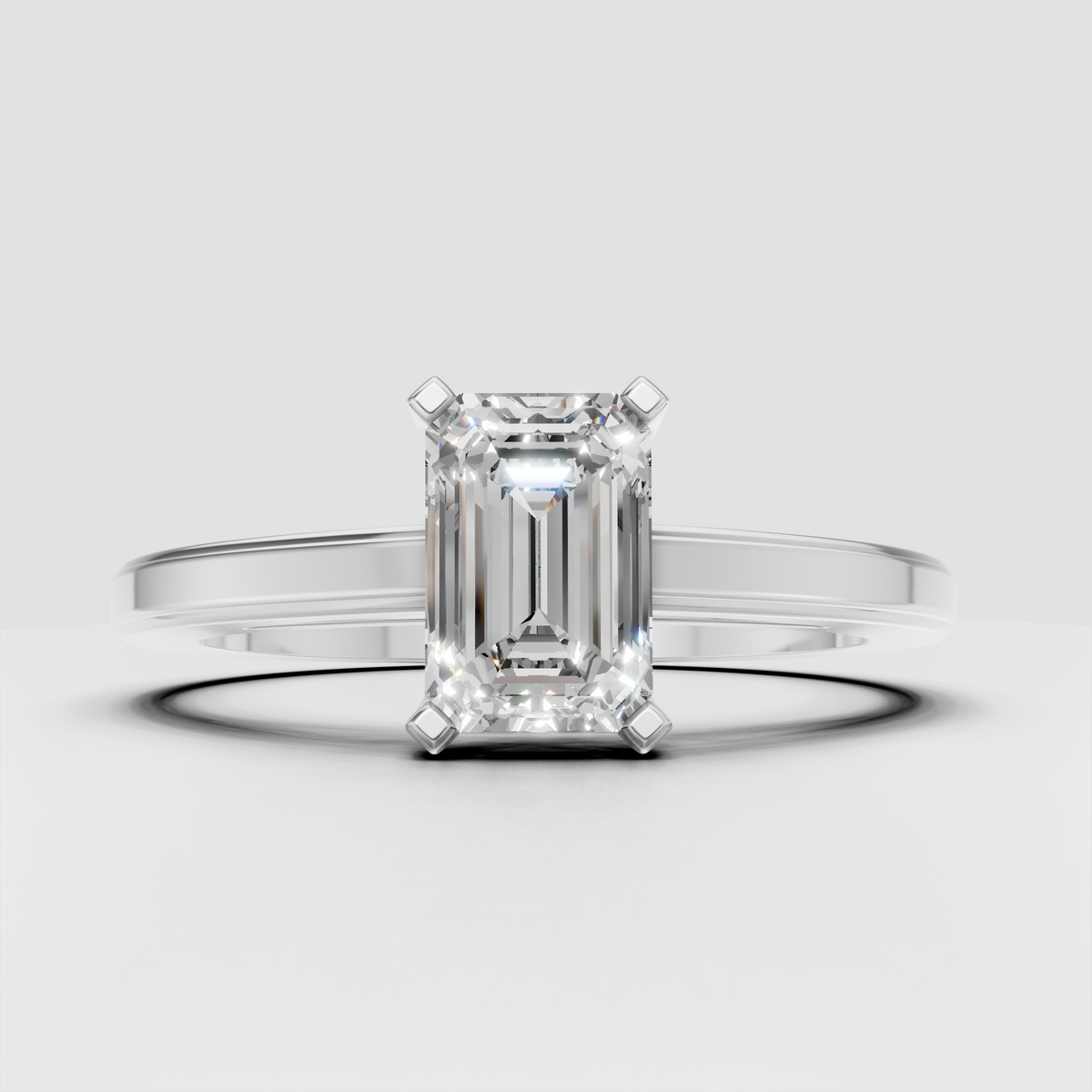 Luxury emerald solitaire engagement ring with split shank design