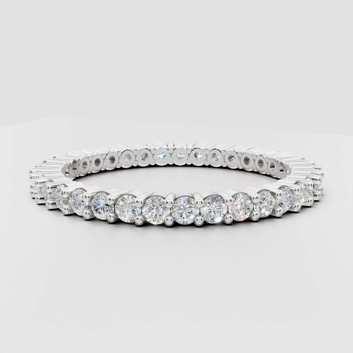 Oval diamond ring featuring a slim pavé diamond band
