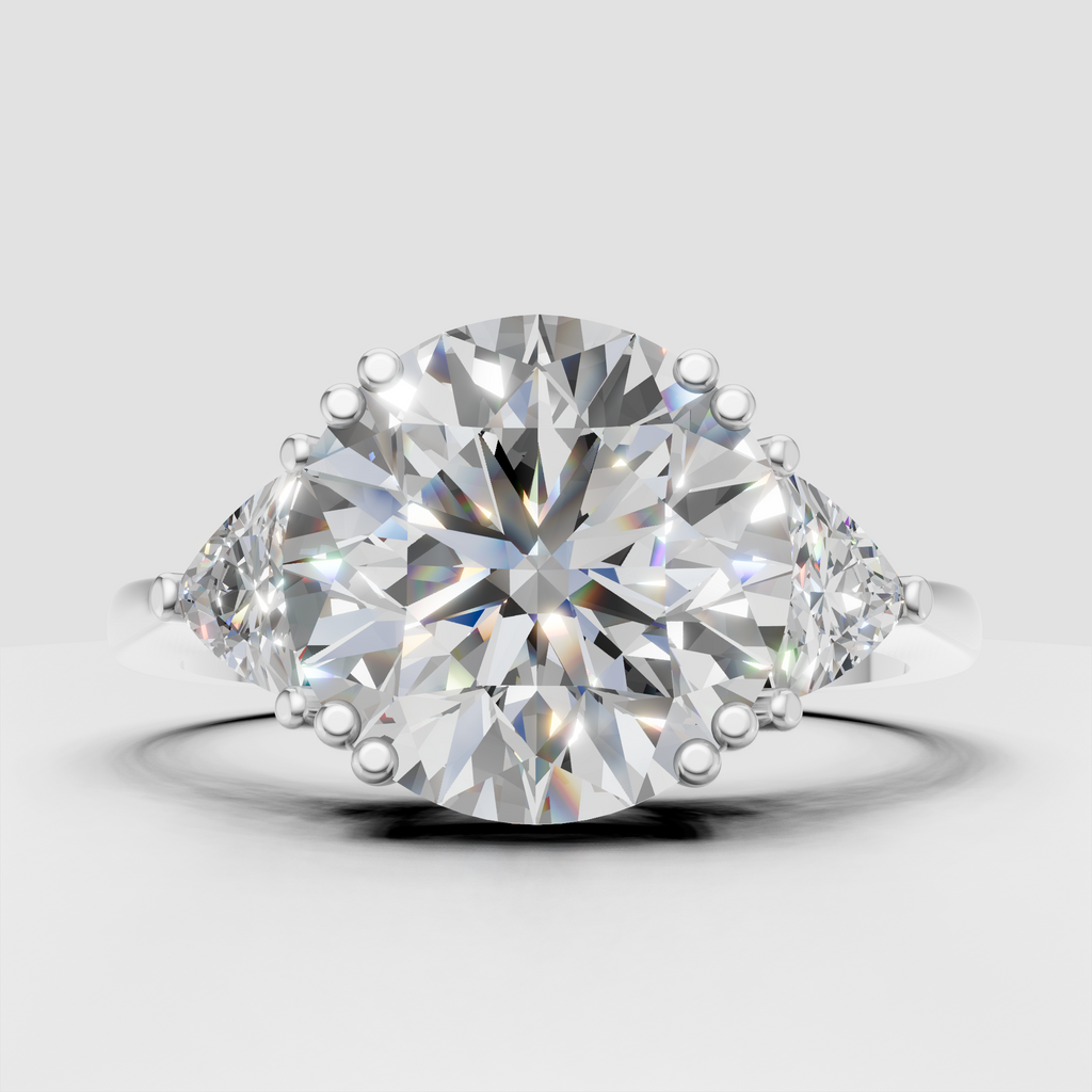 Round-cut diamond engagement ring with elegant pear side stones