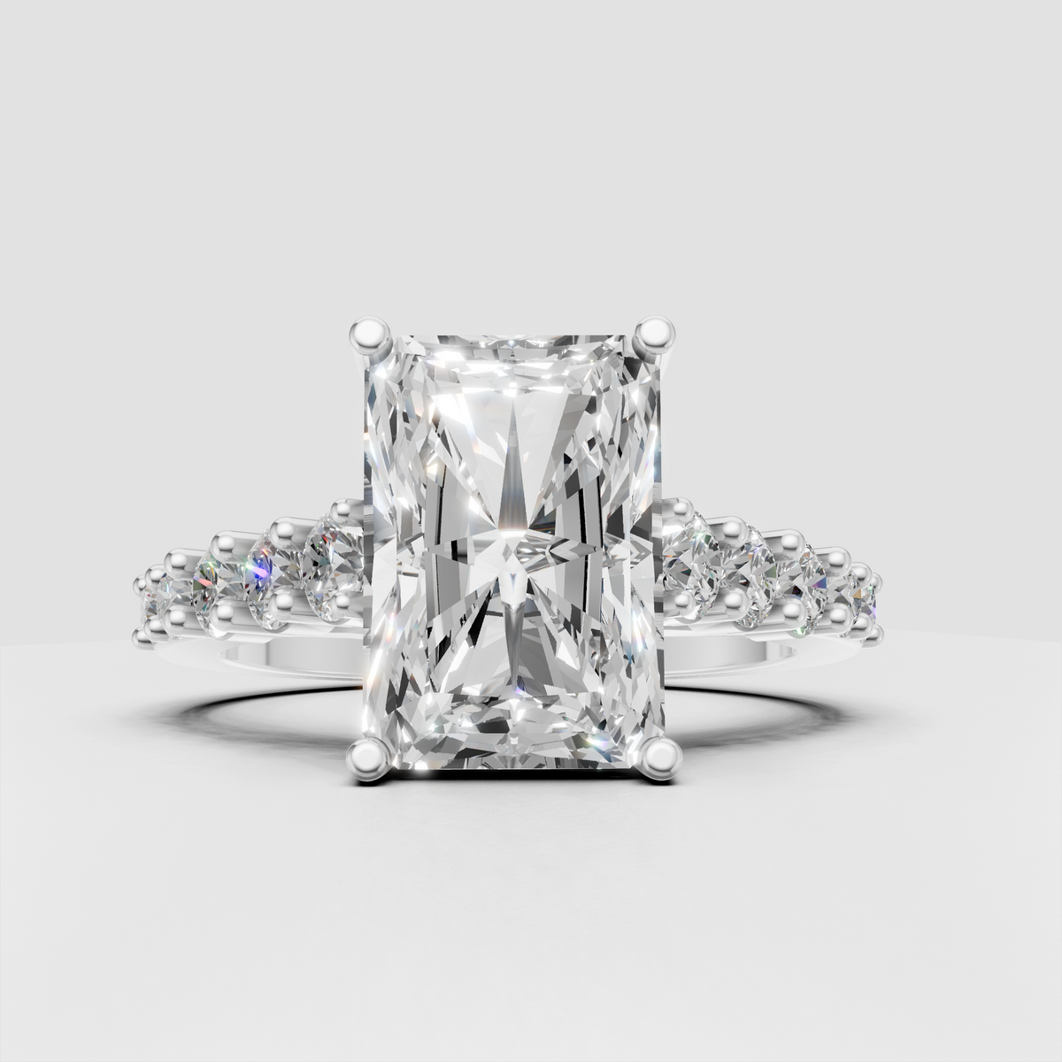 Modern radiant cut diamond ring with sculpted crossover band