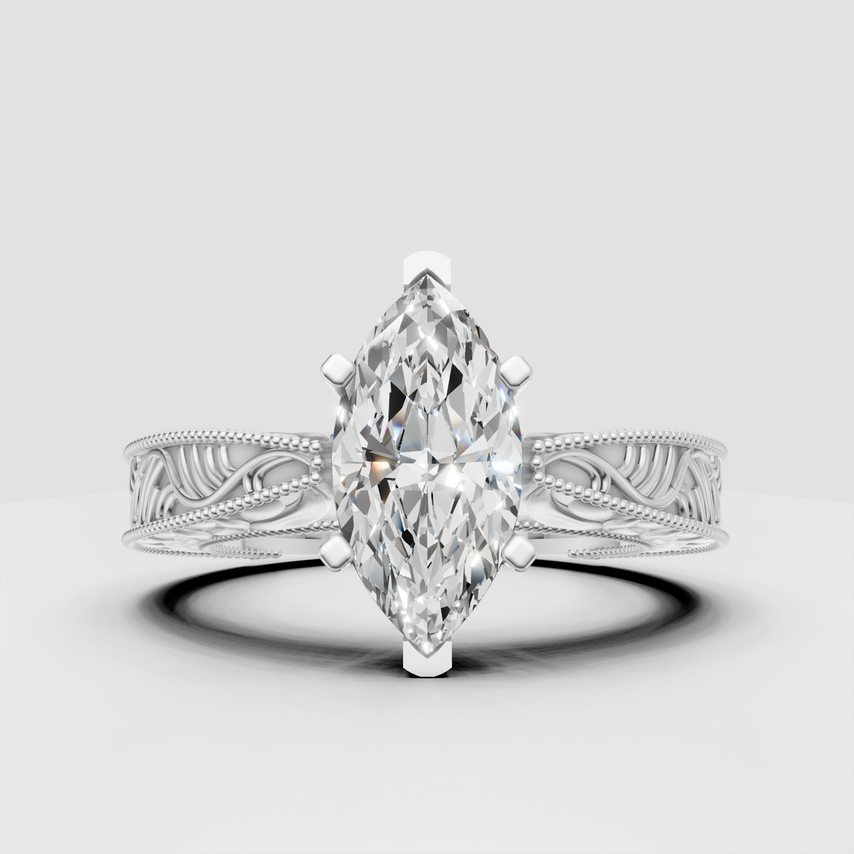 Yellow gold marquise diamond ring with leaf-inspired filigree