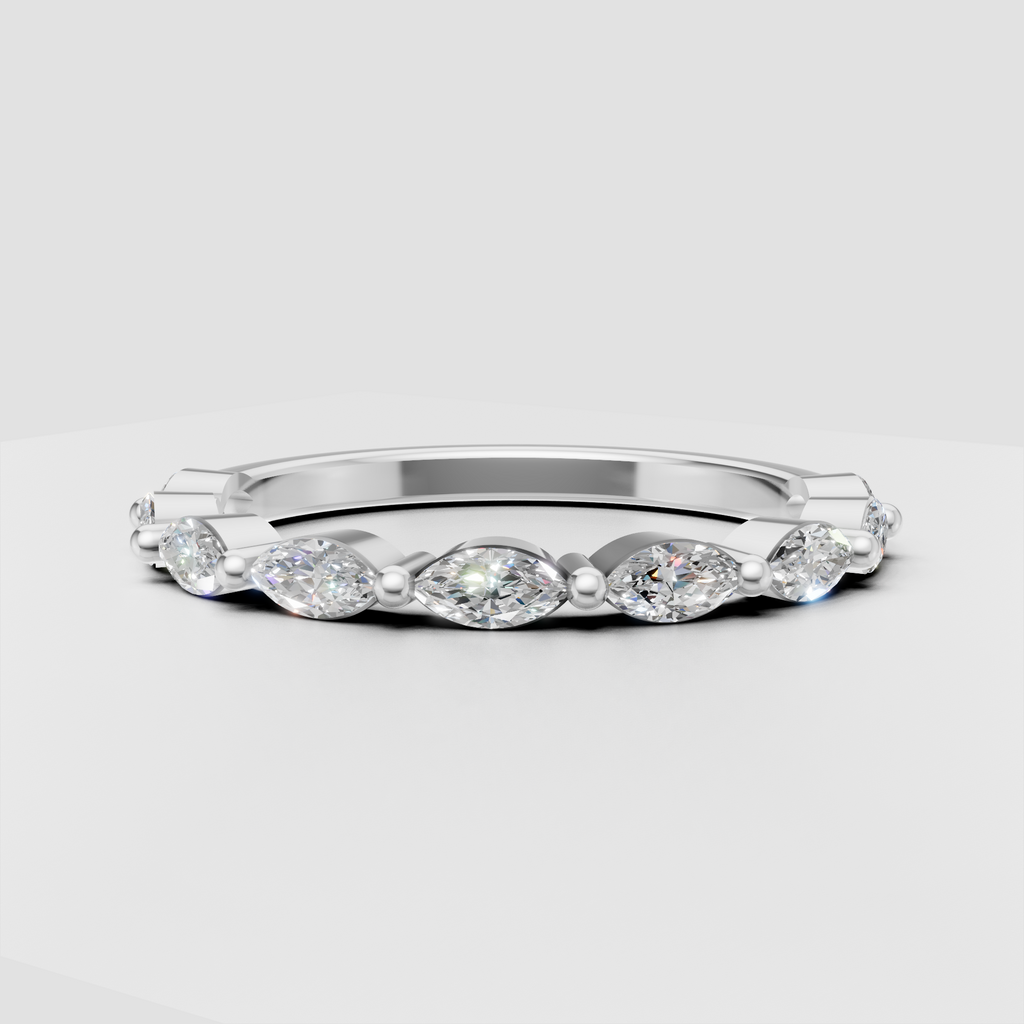 Bezel set marquise diamond eternity ring with polished gold accents