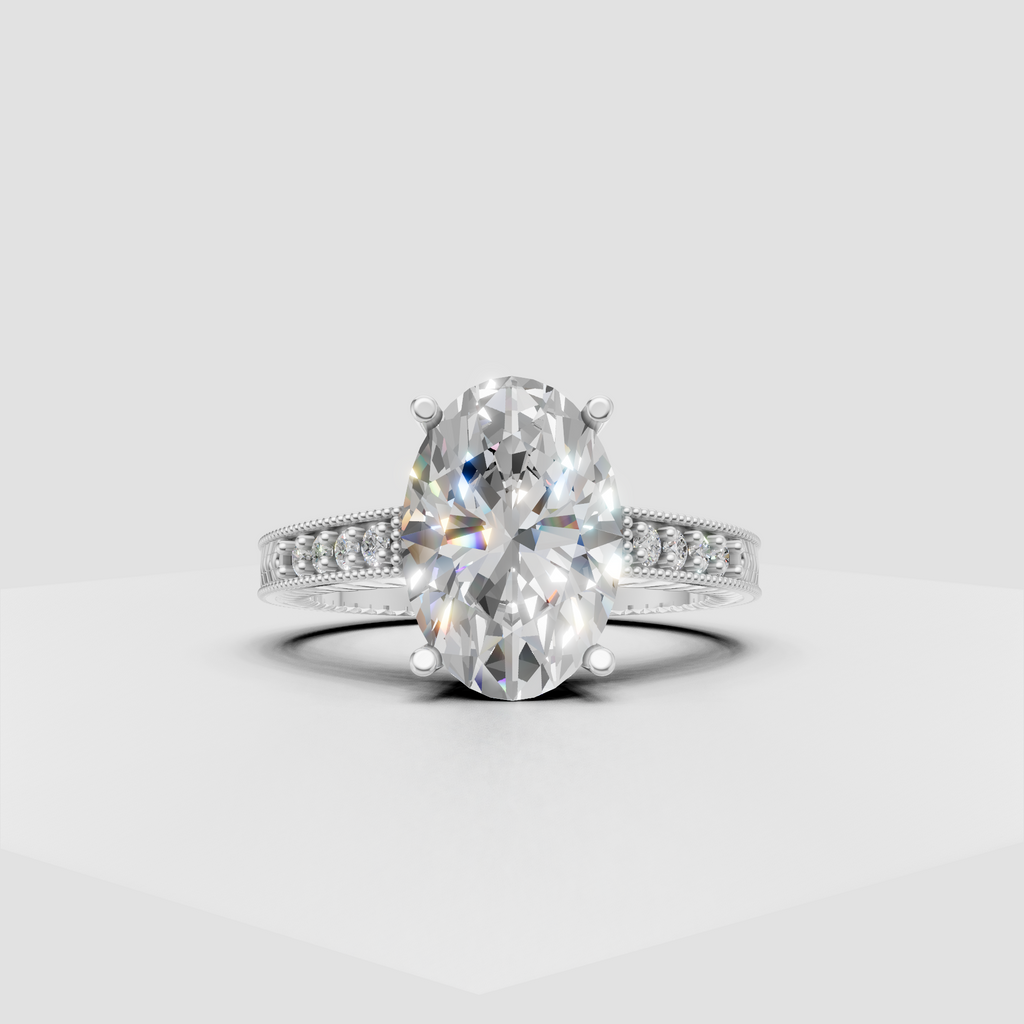 Yellow gold oval diamond engagement ring with pavé shoulders