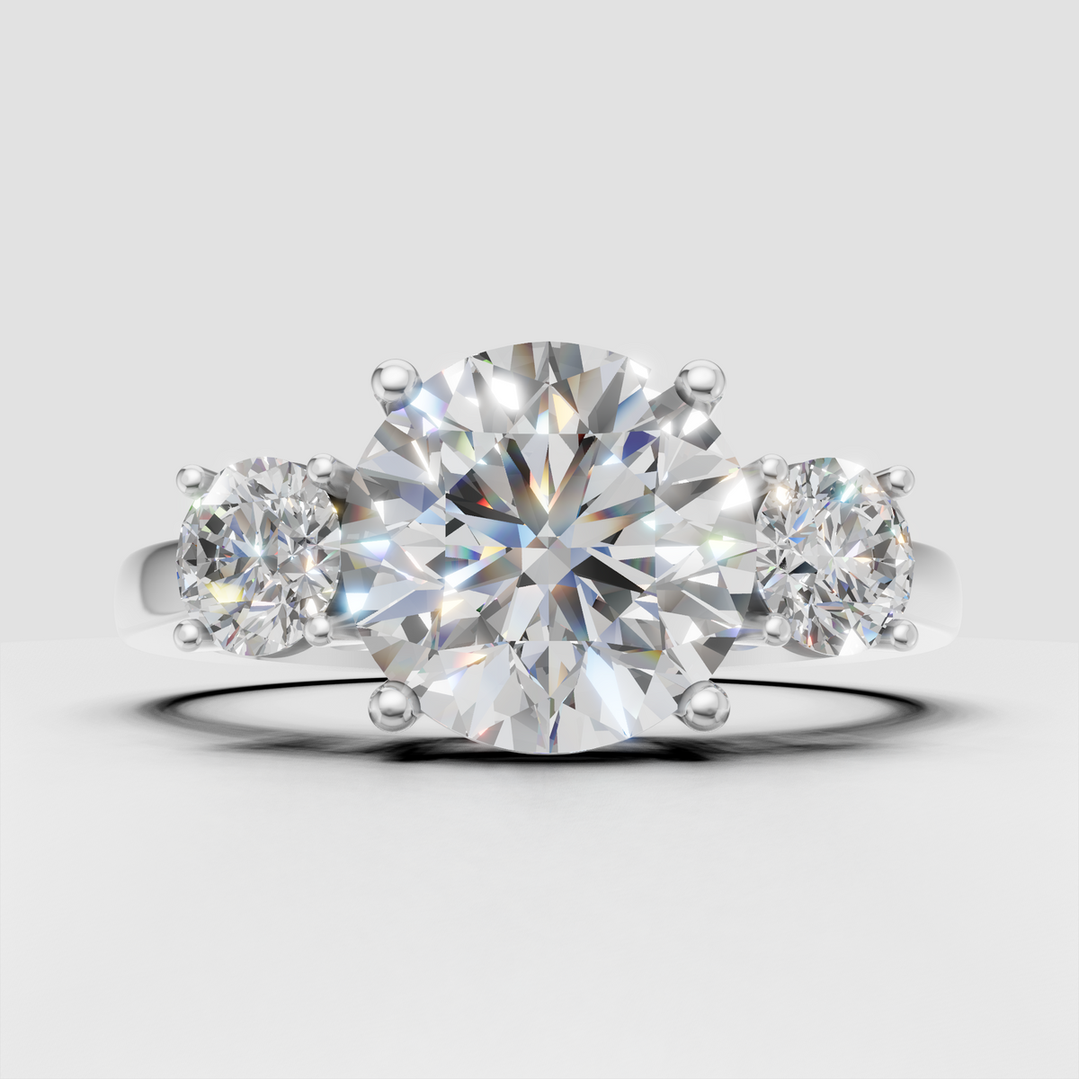 Yellow gold round diamond trilogy ring